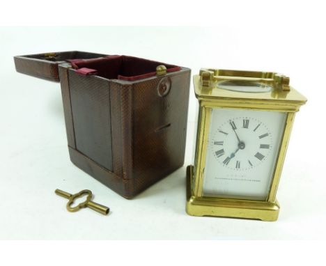 A late 19th century brass carriage clock in leather case 