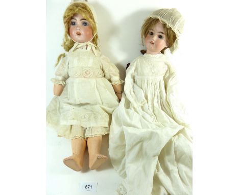 An Armand Marseille bisque headed doll marked 390 and another bisque headed doll a/f 