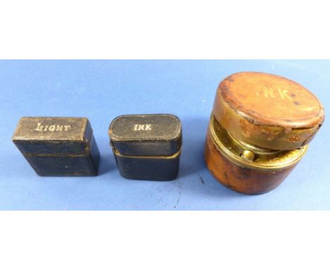 A travelling leather clad inkwell and matching vesta case and an early 19th century brass and leather inkwell 