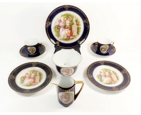 A Czechoslovakian tea service with Viennese style decoration and blue and gilt ground, comprising six cups and saucers, cake 