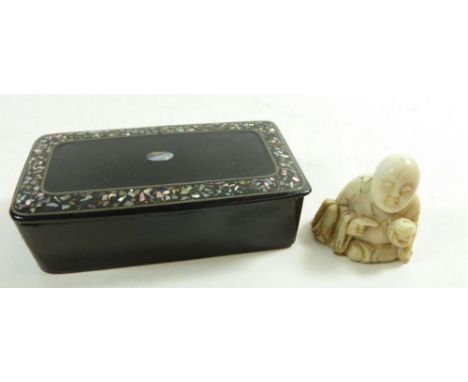 A papier mache snuff box and an antique ivory Japanese seated figure 