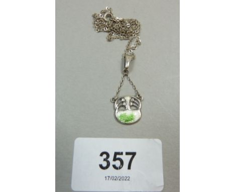An Art Nouveau enamel and silver pendant by Charles Horner suspended on a sterling silver chain 