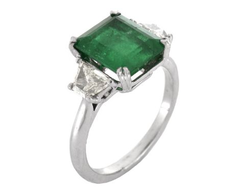 Vintage Approx. 3.20 Carat Colombian Emerald, .90 Carat Trapezoidal Cut Diamond and Platinum Ring. Emerald with vivid color. 