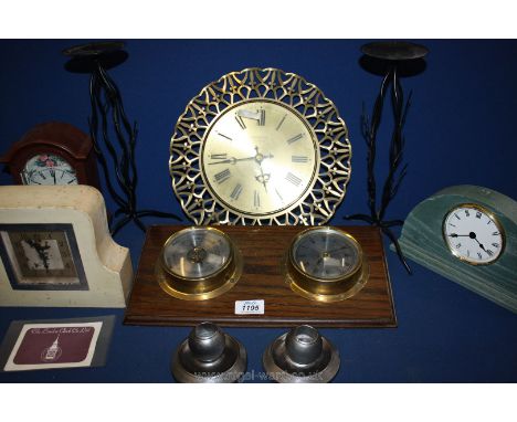 A wooden and brass barometer and clock, Smiths clock and three others together with two pairs of candlesticks.