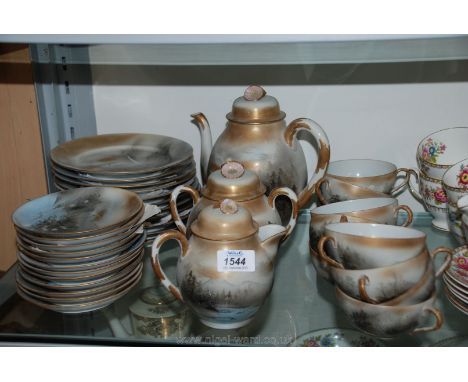 An oriental tea service including nine cups, twelve saucers, nine plates, two bread/butter plates, teapot, milk jug and lidde