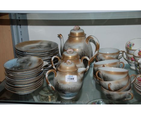 An oriental tea service including nine cups, twelve saucers, nine plates, two bread/butter plates, teapot, milk jug and lidde