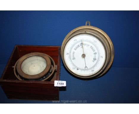 A bronzed case Barometer and Compass in Mahogany box mounted on a gimbals, both well worn.