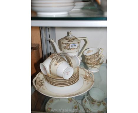 A Noritake coffee set, cream with gold coloured embossing, including six coffee cups, six saucers, sugar bowl, coffee pot and