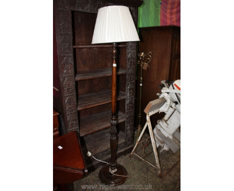 A darkwood turned and carved pillar Standard Lamp with turned base and pleated cream shade, 70'' high approx.