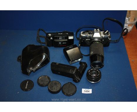 An Olympus OM-10 camera and lens, a Minolta Alto Focus, lens and flash gun.