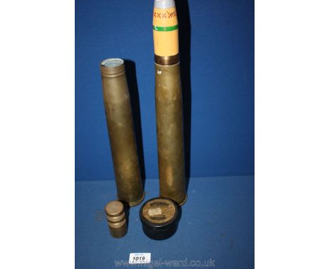 A 1lb Brass weight, .22 cal. hunting pellets, and two empty Brass cartridges