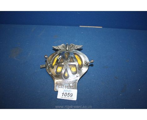 An AA car Badge with fitments and yellow liner, stamped OY20616.