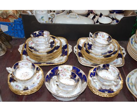 A very pretty Coalport tea set including ten cups and saucers, twelve tea plates, two bread and butter plates, slop bowl, (so