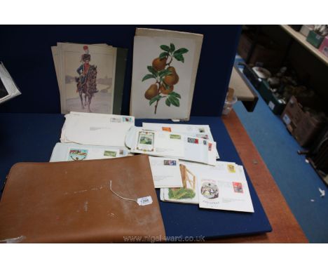 A briefcase containing First Day Covers.