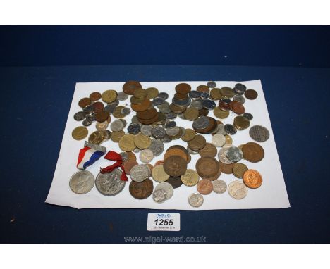 A quantity of foreign and British coins including sixpence, Isle of Man one pound, francs etc. together with Coronation of Ki