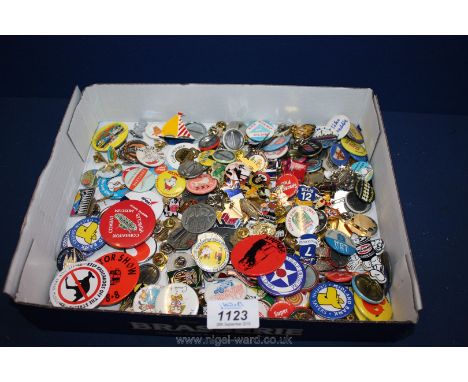 A large quantity of enamel and button badges.