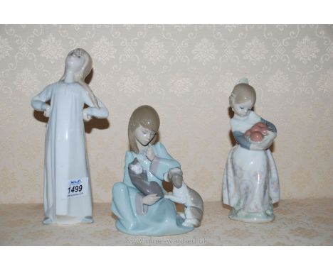 Three Lladro girl figures including a girl standing with hands on hips, a girl carrying oranges and a girl sitting with a cat