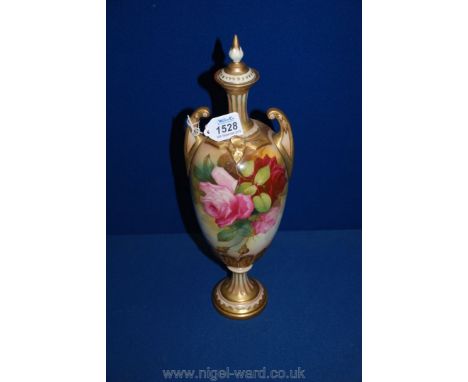 A Royal Worcester lidded vase with reeded delicate base and highlighted with gilding, two open handles and rose detail decora