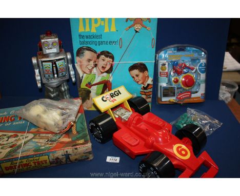 A mixed lot of toys and games including ideal tip-it, Merit driving test and robot, working.