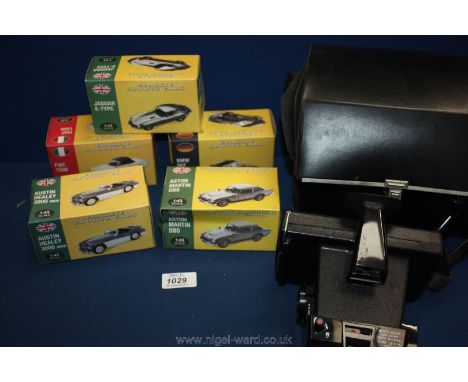 A quantity of model sports cars including Fiat 500, Aston Martin DB5 and Austin Healey 3000 MK3, all boxed and a cased Polaro