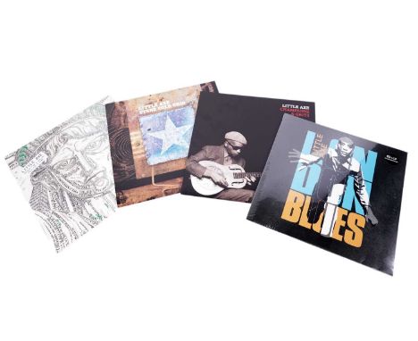 Four records by Dub-Blues project 'Little Axe': Champagne &amp; Grits; Stone Cold Ohio; Bought for a Dollar, Sold for a Dime 