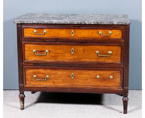 A 19th Century French mahogany commode of "Empire" design, with grey veined marble slab to top, fitted three long graduated d