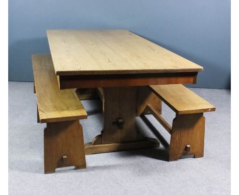 A 20th Century light oak refectory table of "17th Century" design, four plank top, on solid end supports and trestle feet, 84