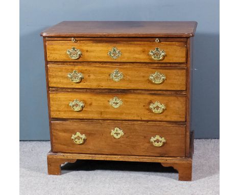 An early George III mahogany chest with moulded edge to top and re-entrant front corners, fitted with brushing slide and four