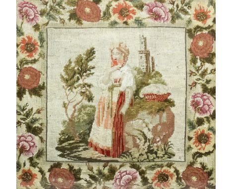A Victorian needlework panel depicting a full length portrait of a young woman within wide floral border, 20ins x 21.5ins, in