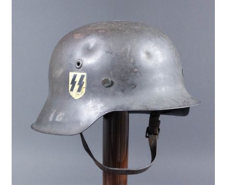 A good Second World War German SS steel helmet, model M42, with single lightning flash decal, interior of helmet stamped "N.S