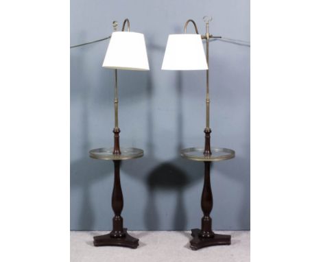 A pair of mahogany and brass mounted lamp tables with adjustable brass columns, circular galleried tiers on balluster turned 