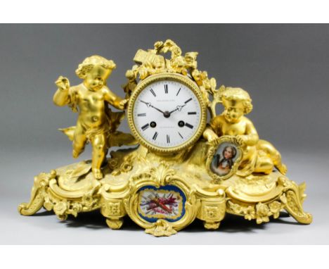 A late 19th Century French gilt brass and porcelain mantel clock by Thomas Pearce & Son, Paris and London, No. 2109, the 3.5i