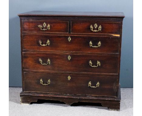 A George III mahogany chest, the top inlaid with crossbanding and with moulded edge, fitted two short and three long drawers,