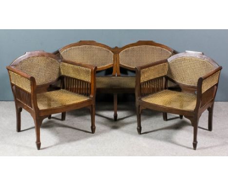 An Anglo Indian hardwood framed Bergere lounge suite, retailed by the Army & Navy Stores, Calcutta, with shaped crest rails a