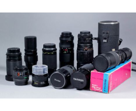 A collection of nineteen SLR camera lenses, including Makes Tamron, Photax, and Pentax, together with five lens converters, a
