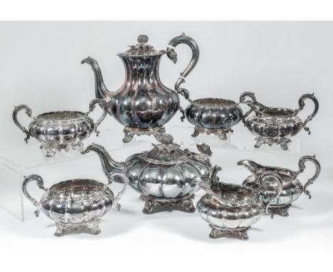 An Elizabeth II silver eight piece tea and coffee service of Victorian design circular lobed form, with pomegranate and leaf 