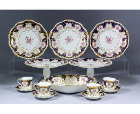 An early 20th Century Bishop & Stonier bone china part dessert service for Harrods, painted with pink roses and garlands, the