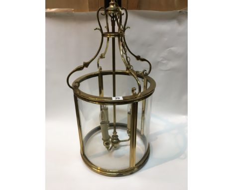 A brass and glass hall lantern light 38cm diameter Hight 80cm
