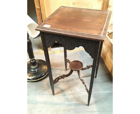 An Edwardian mahogany square top occasional table with blind fretwork.