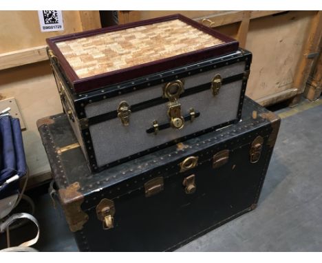 A large Vintage traveling trunk an aluminium trunk and a tray set with numerous wine bottle corks. (3)