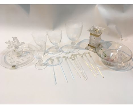 A collection of Lalique glass comprising animal swizzle sticks a dish square candle holder glasses a scent bottle and an art 