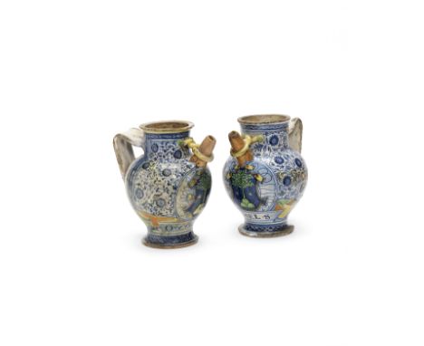 A Pair of Faenza maiolica armorial wet drug jars, circa 1525Each decorated with a coat of arms of a tree within an escutcheon