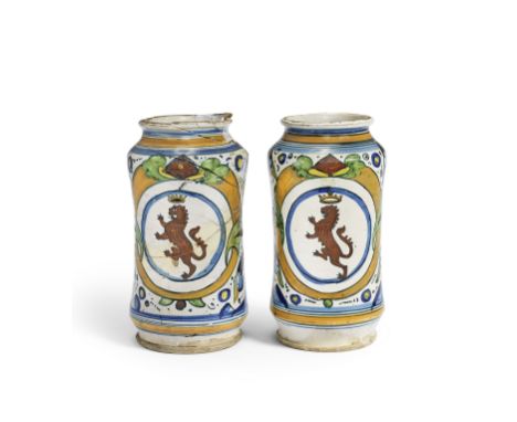 A Pair of Montelupo maiolica Armorial Albarelli, circa 1520Each painted with the Giraldi family arms of a crowned rampant lio