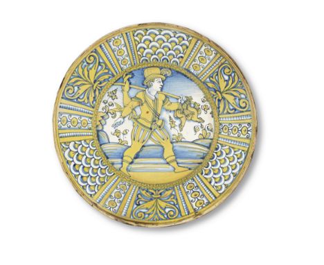 A Deruta maiolica charger, circa 1530Painted in blue and lustre, the cavetto with a  huntsman carrying a game-bird and hare o