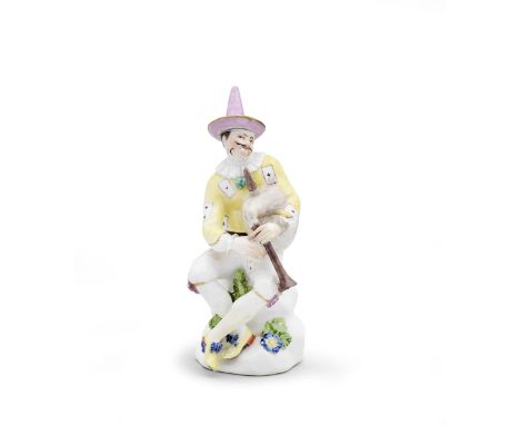 A Meissen figure of a bagpipe player, mid 18th centuryWearing a yellow jacket decorated with playing cards, a pink hat, white