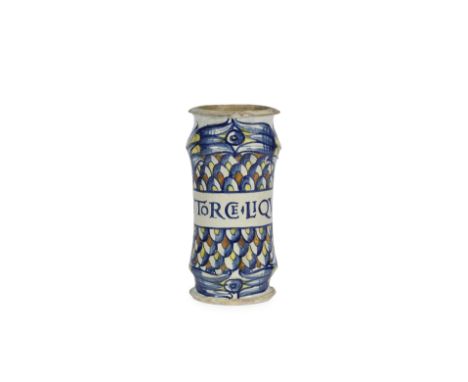 A Deruta maiolica albarello, circa 1530-50Decorated with a drug label inscribed 'STORCE.LIQV' on an overlapping scale pattern