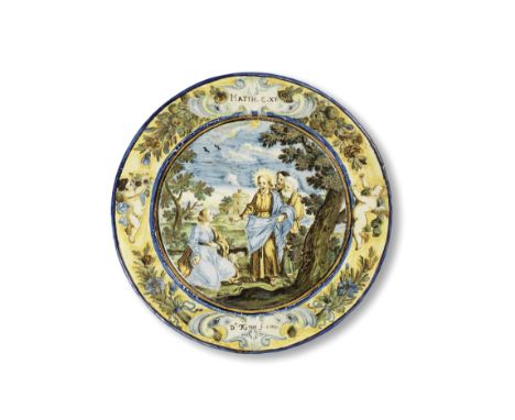 A documentary Castelli maiolica small plate, dated 1737Painted by Francesco Grue in enamels and gilding with a scene from the