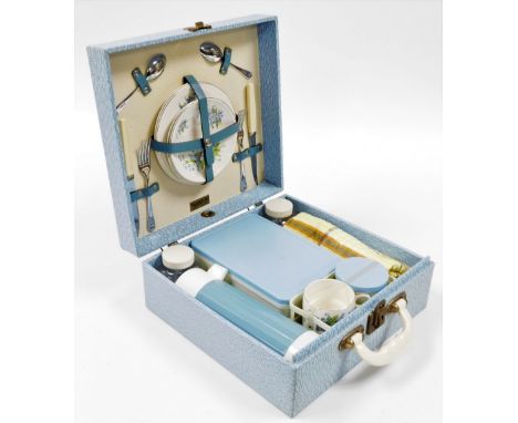 A Brexton picnic hamper, in blue detailing with ceramic plates, 15cm high, 34cm wide, 33cm deep.