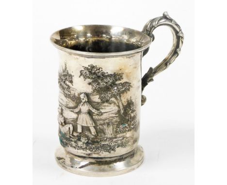 A Victorian silver tankard, with chased detail of children fishing by trees, with leaf scroll handle on a stepped foot, maker