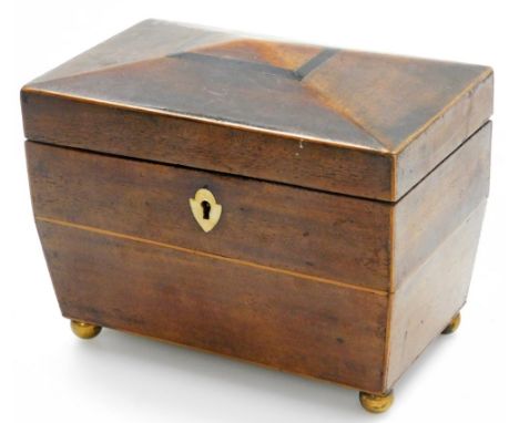 A 19thC mahogany tea caddy, with domed top, and a bone escutcheon, with fitted interior, on bun feet, 13cm high, 19cm wide, 1